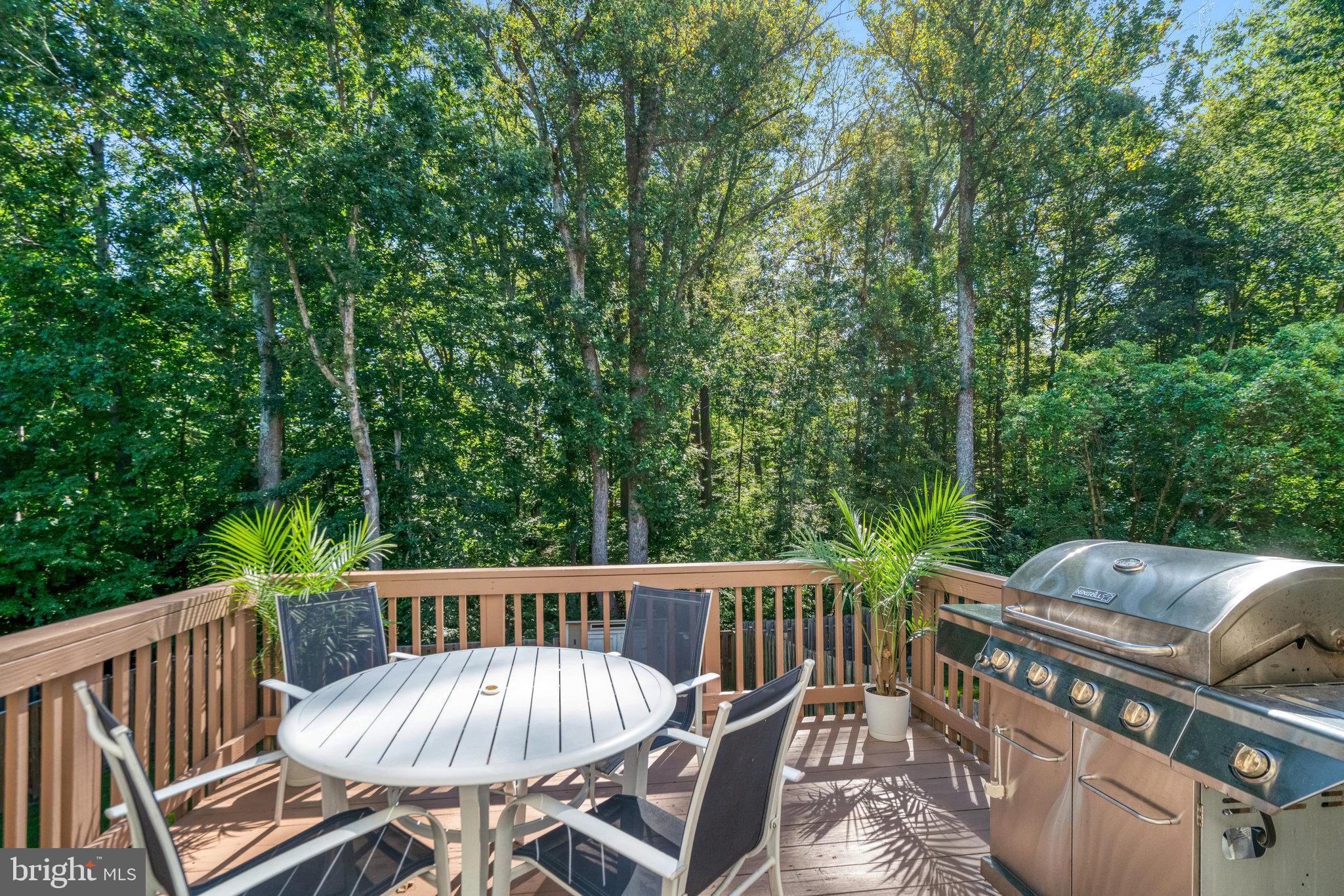 7923 Forest Path Way Springfield, VA 22153 - Photo 8 of 39 a view of a deck with furniture and trees