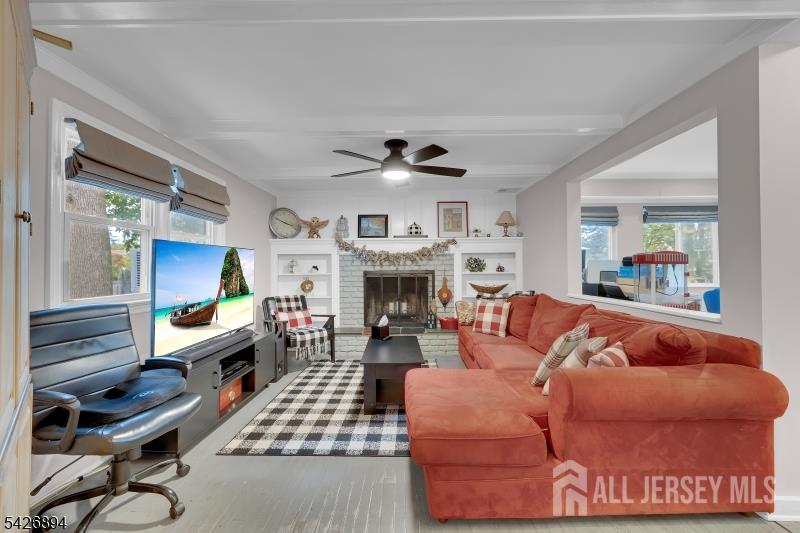 233 Maple Avenue Dunellen, NJ 08812 - Photo 12 of 39 a living room with furniture fireplace and window