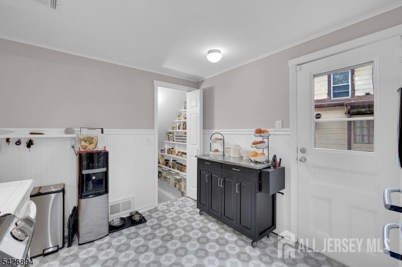 233 Maple Avenue Dunellen, NJ 08812 - Photo 17 of 39 a kitchen with a sink stove and refrigerator