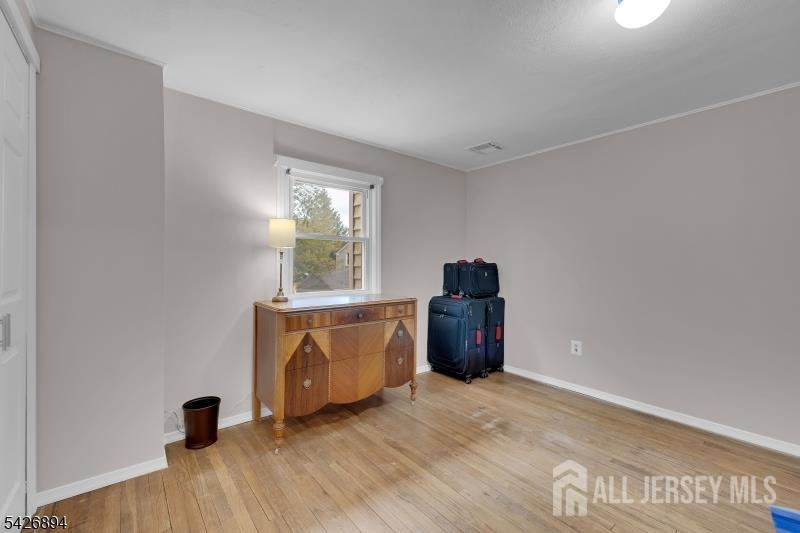 233 Maple Avenue Dunellen, NJ 08812 - Photo 24 of 39 a view of a workspace with furniture and a window