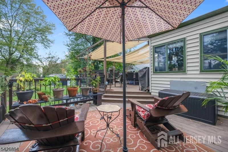 233 Maple Avenue Dunellen, NJ 08812 - Photo 29 of 39 a outdoor living space with furniture and umbrella