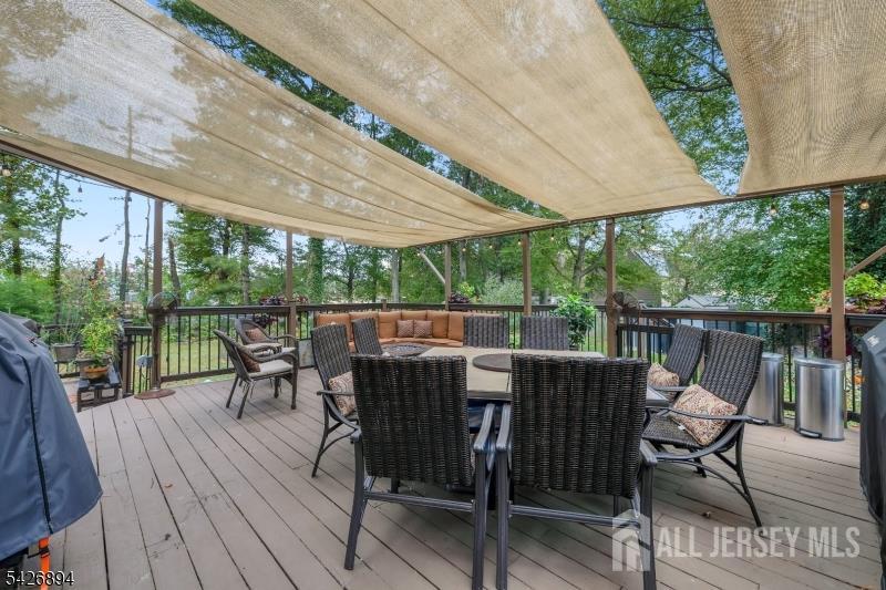 233 Maple Avenue Dunellen, NJ 08812 - Photo 31 of 39 a view of a patio with a table chairs and a backyard