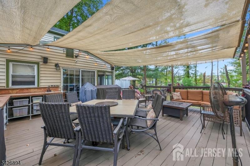 233 Maple Avenue Dunellen, NJ 08812 - Photo 32 of 39 a view of a patio with a table chairs and a backyard