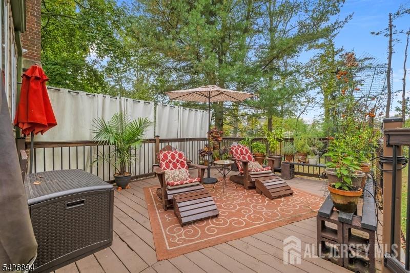 233 Maple Avenue Dunellen, NJ 08812 - Photo 35 of 39 an outdoor sitting area with couch and wooden fence