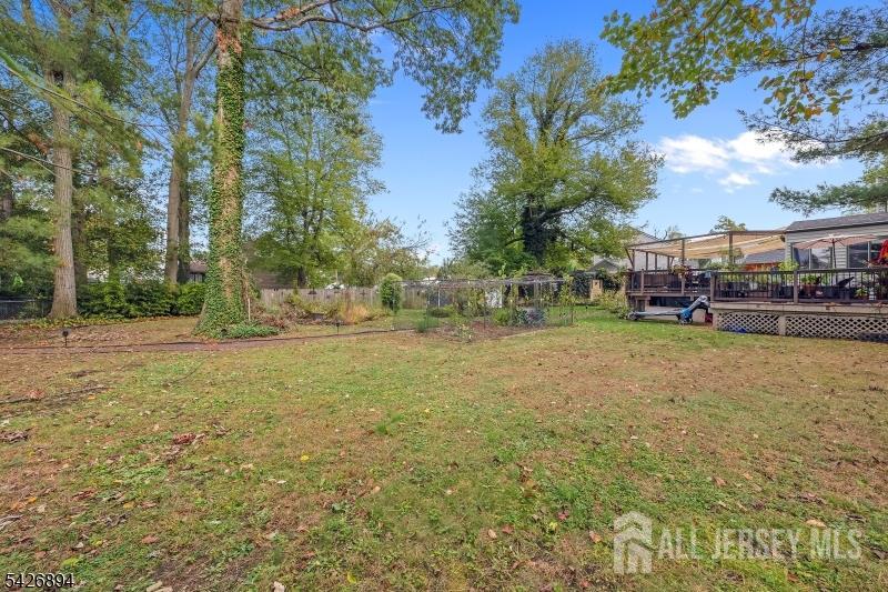 233 Maple Avenue Dunellen, NJ 08812 - Photo 37 of 39 a view of outdoor space with deck and trees