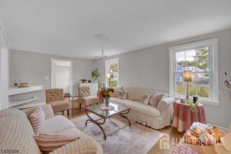 233 Maple Avenue Dunellen, NJ 08812 - Photo 7 of 39 a living room with furniture and a large window