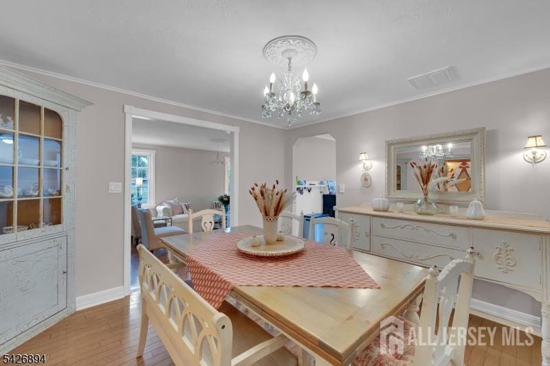 233 Maple Avenue Dunellen, NJ 08812 - Photo 10 of 39 a kitchen with kitchen island a sink and wooden floor