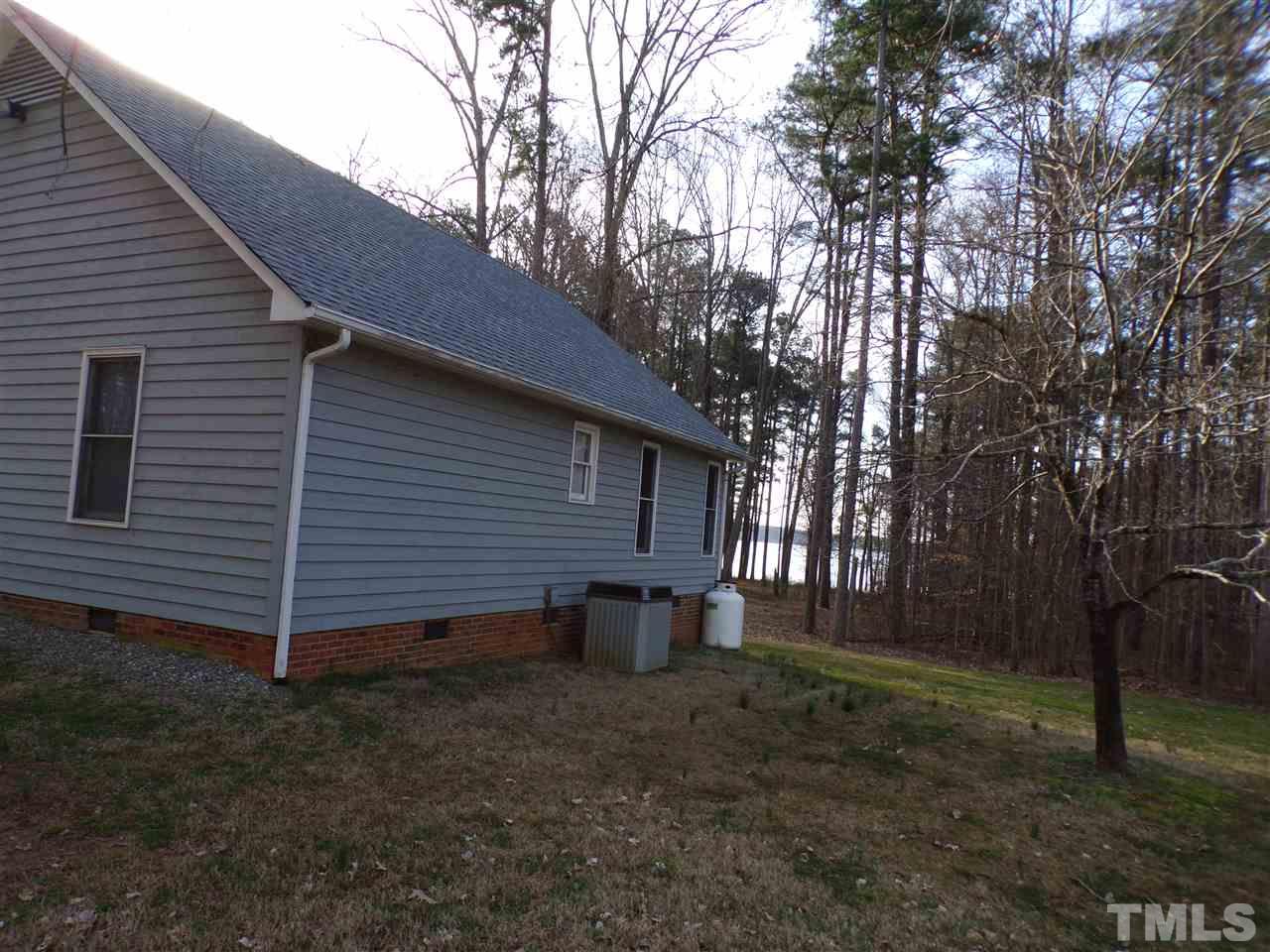 5400 Thomas Road Henderson, NC 27537 - Photo 3 of 8 a view of a backyard with large trees