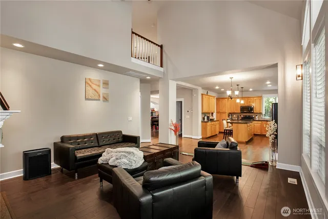 a living room with furniture and a glass door