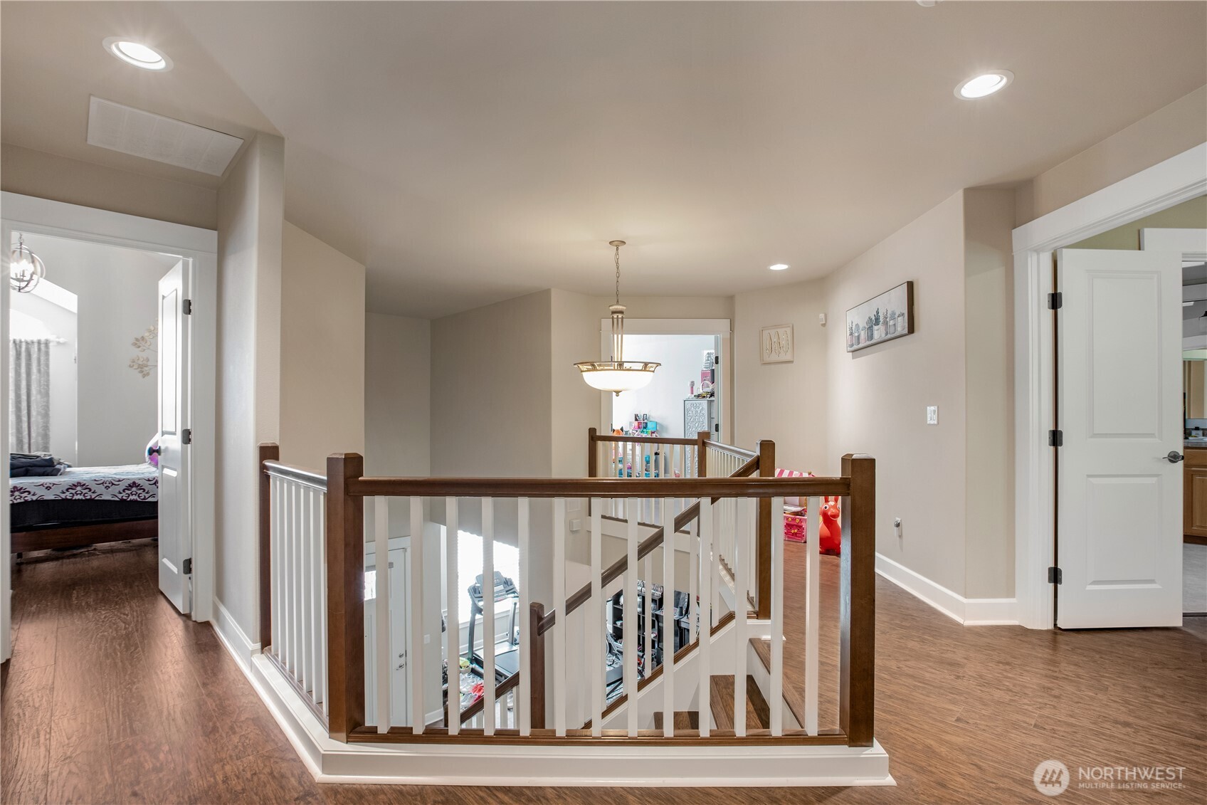 3930 Cameron Drive Northeast Lacey, WA 98516 - Photo 19 of 40 a view of a hallway with wooden floor and stairs