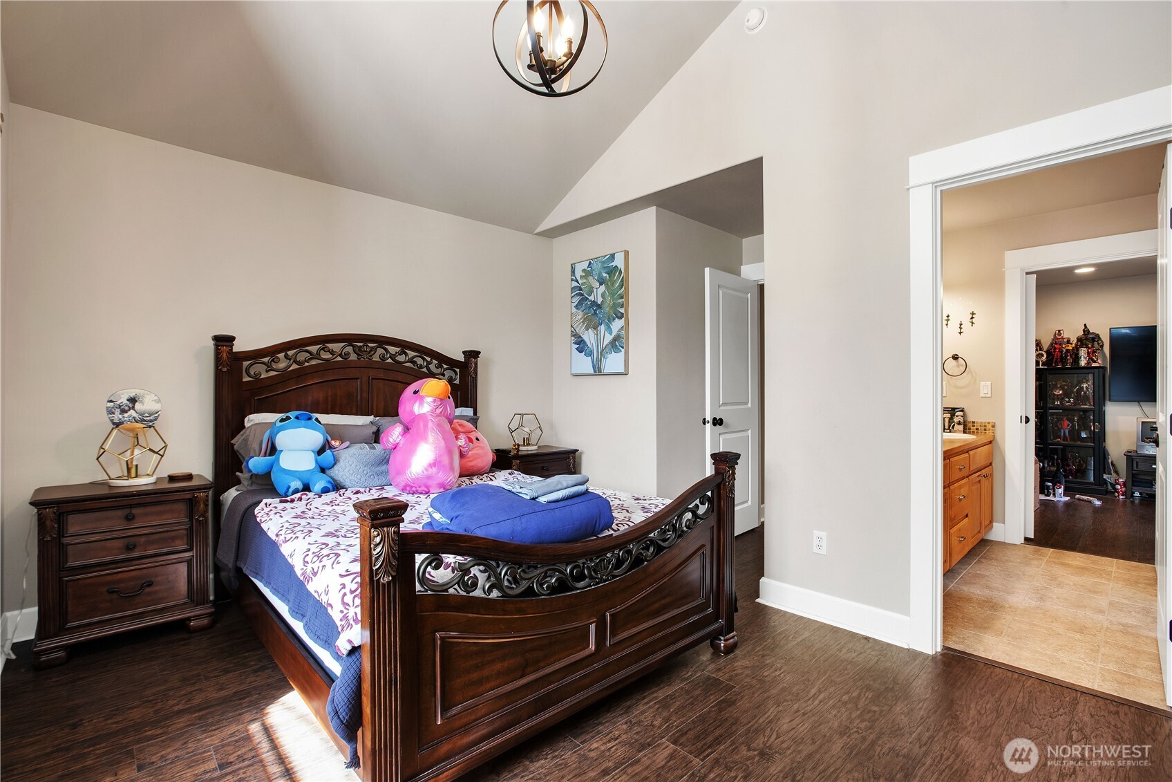 3930 Cameron Drive Northeast Lacey, WA 98516 - Photo 20 of 40 a bedroom with a bed and wooden floor