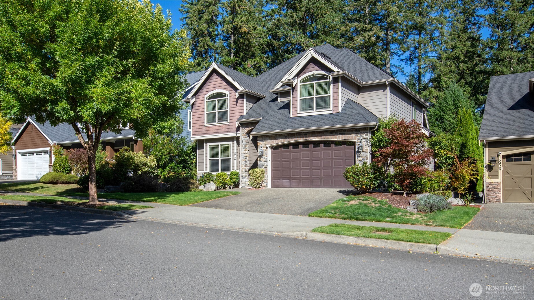 3930 Cameron Drive Northeast Lacey, WA 98516 - Photo 2 of 40 a front view of a house with a yard and garage