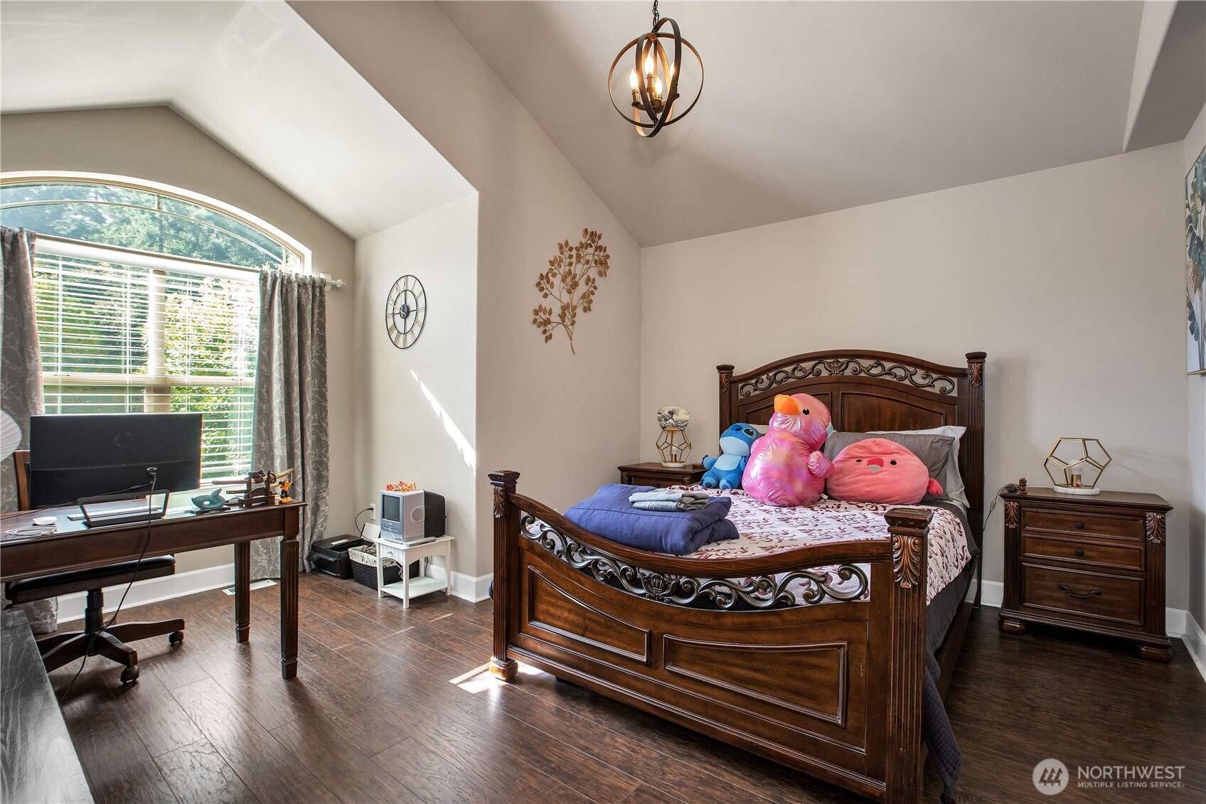 3930 Cameron Drive Northeast Lacey, WA 98516 - Photo 21 of 40 a bedroom with a bed and a chandelier