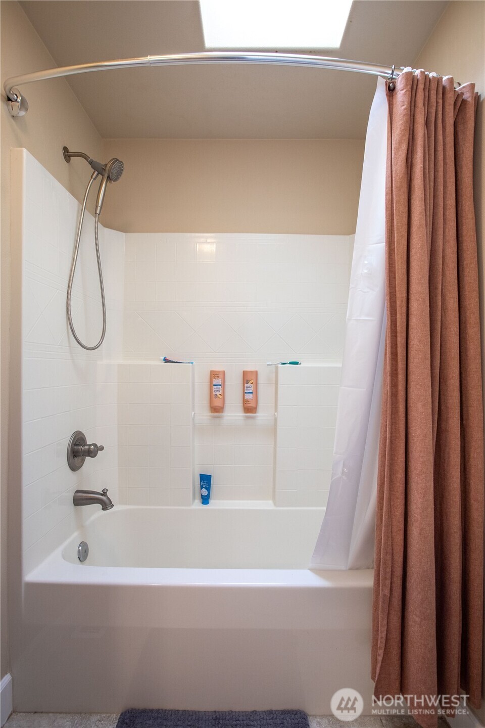 3930 Cameron Drive Northeast Lacey, WA 98516 - Photo 22 of 40 a bathroom with a shower and a bathtub