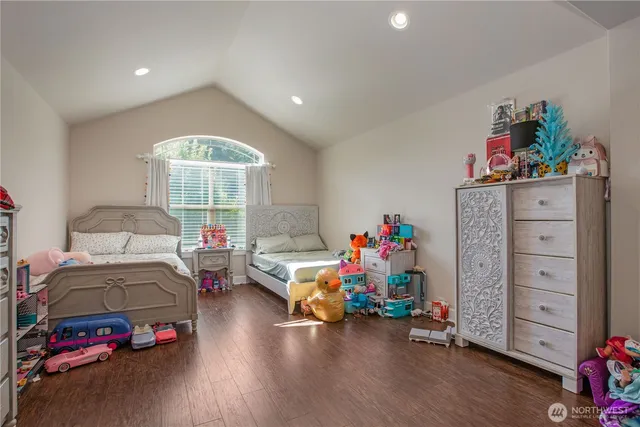 a bedroom with furniture and a window