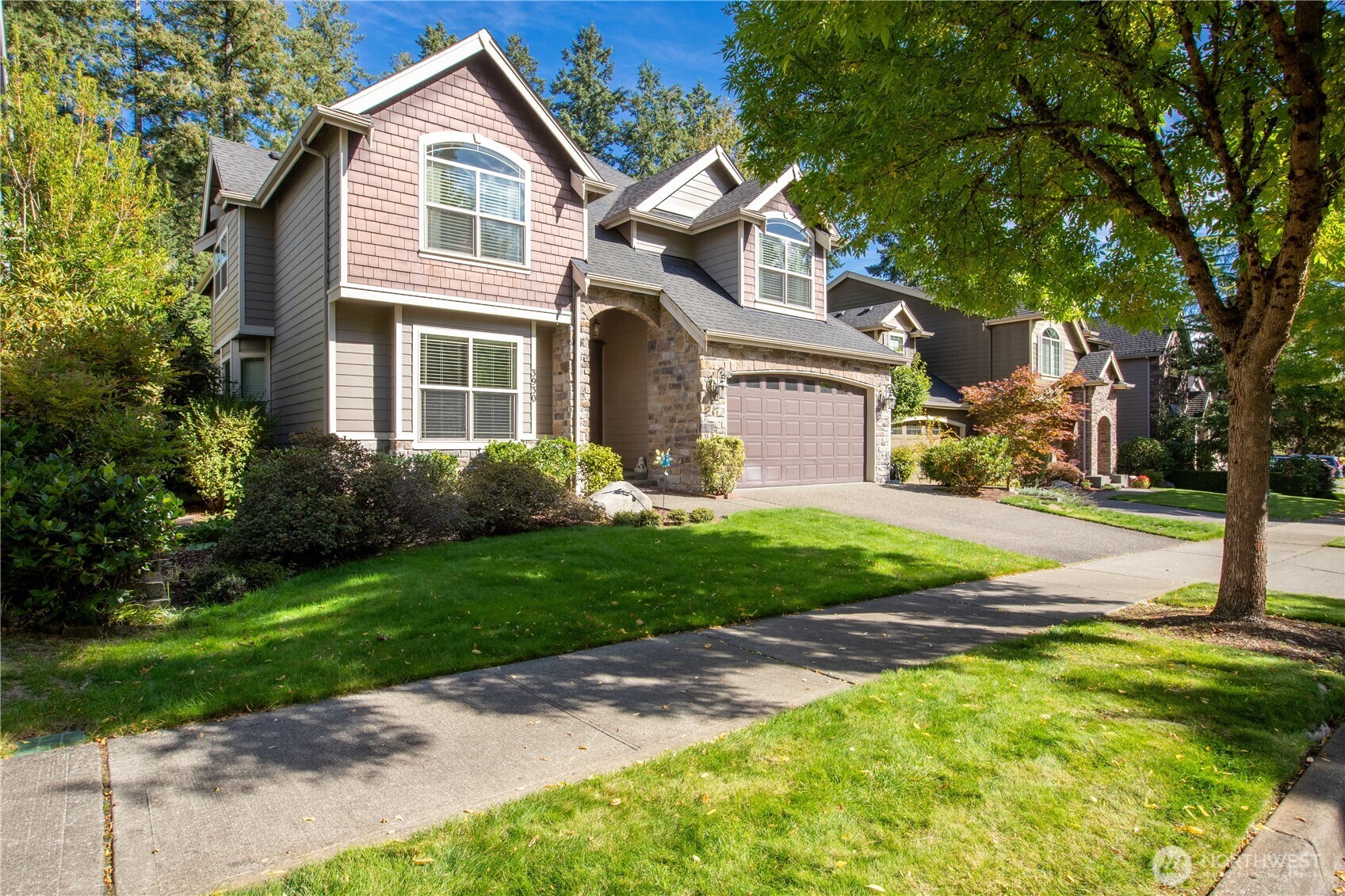 3930 Cameron Drive Northeast Lacey, WA 98516 - Photo 3 of 40 a front view of a house with a yard and trees