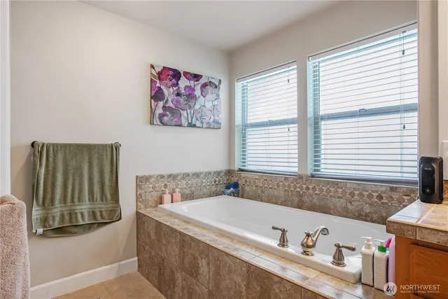 a bathroom with a bathtub and a sink