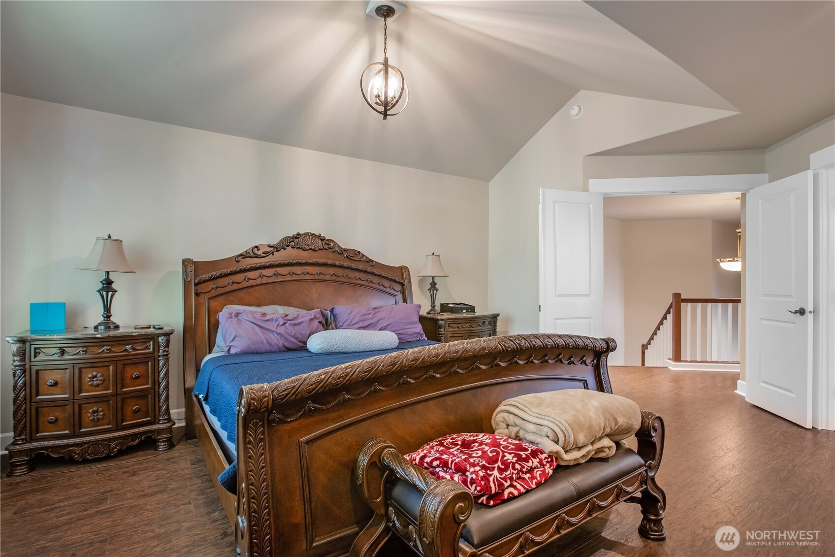 3930 Cameron Drive Northeast Lacey, WA 98516 - Photo 35 of 40 a bedroom with a bed and wooden floor