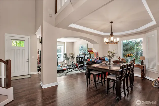 a view of a dining room with furniture window and wooden floor