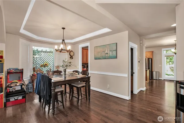 a view of a dining room with furniture window and wooden floor