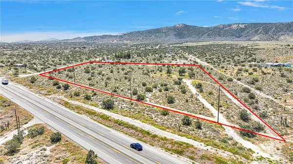 a view of a large body of water and a mountain view