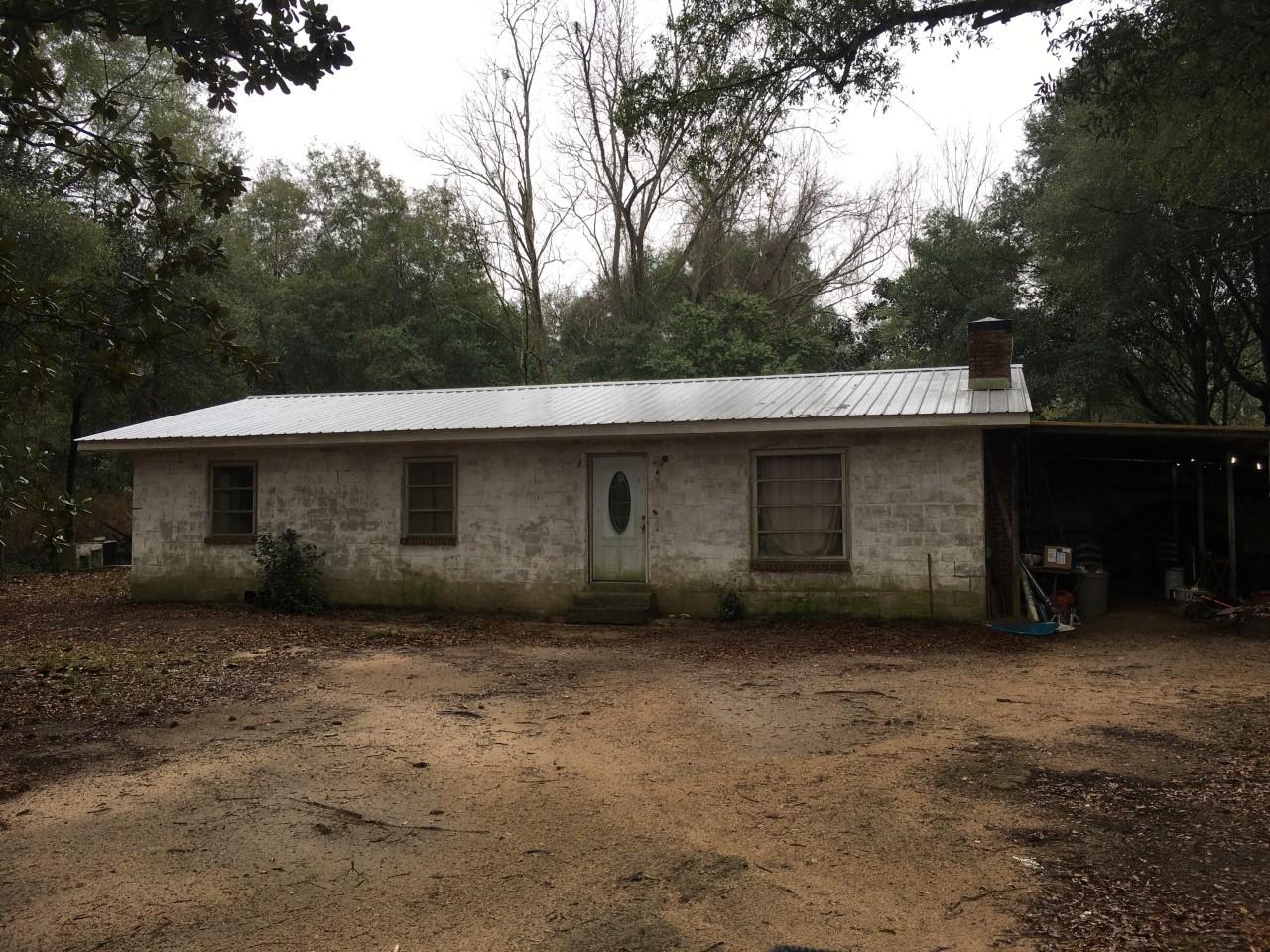 550 Brooks Road Baker, FL 32531 - Photo 1 of 3 a backyard of a house