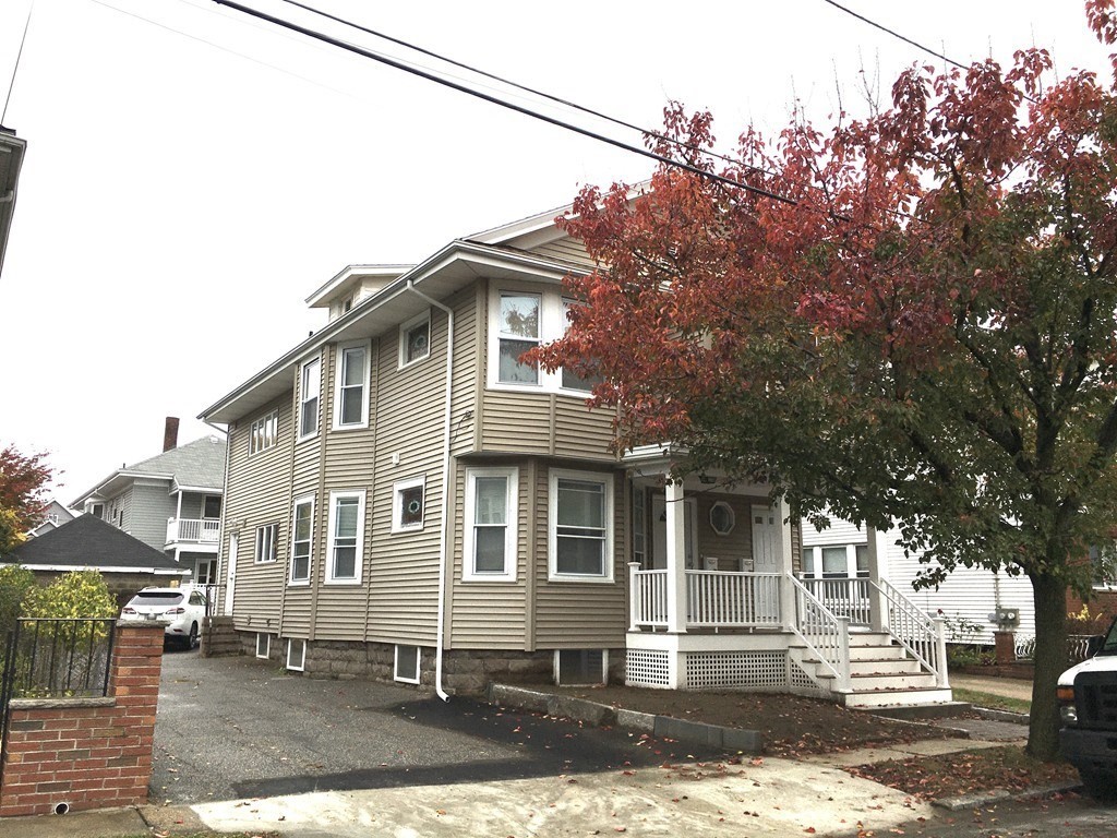 31 Wellington Road Medford, MA 02155 - Photo 11 of 11 a front view of a house with a yard
