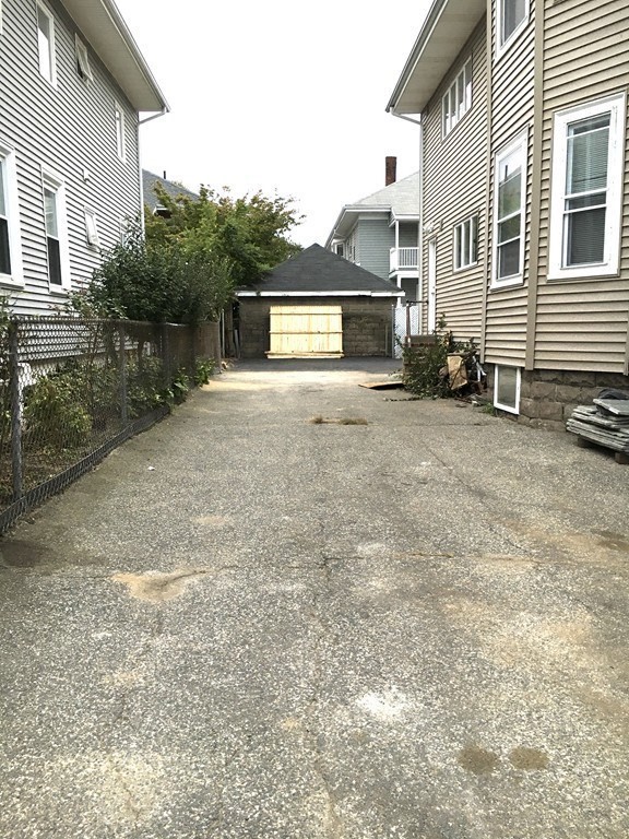 31 Wellington Road Medford, MA 02155 - Photo 10 of 11 a view of a house with a yard