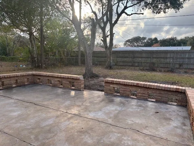 a view of backyard with mountain and trees