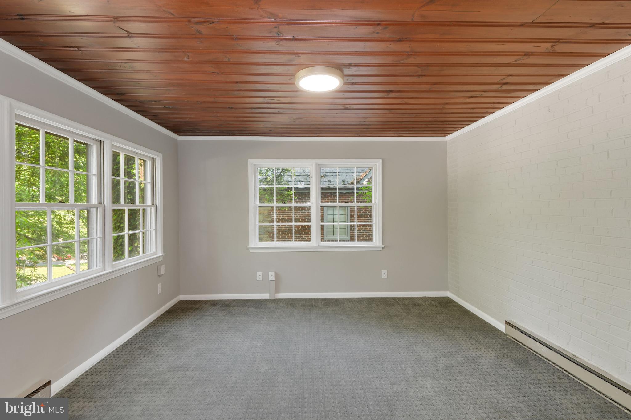 7215 Rollingwood Drive Chevy Chase, MD 20815 - Photo 20 of 42 an empty room with a window