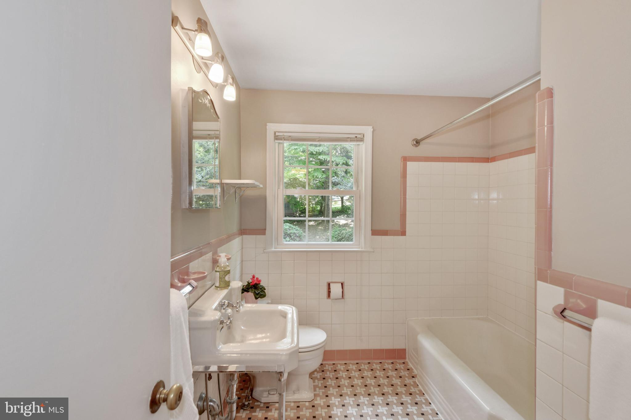 7215 Rollingwood Drive Chevy Chase, MD 20815 - Photo 23 of 42 a bathroom with a sink toilet and shower