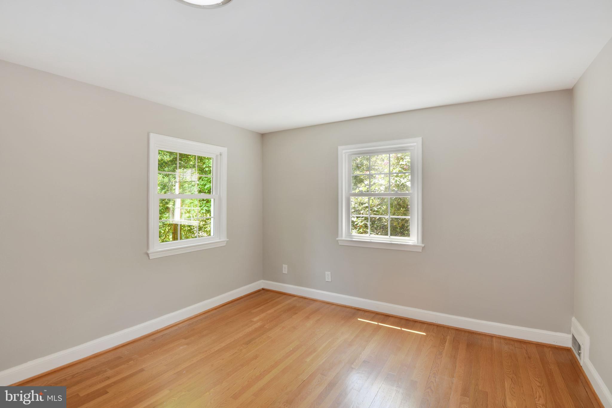 7215 Rollingwood Drive Chevy Chase, MD 20815 - Photo 25 of 42 an empty room with a window