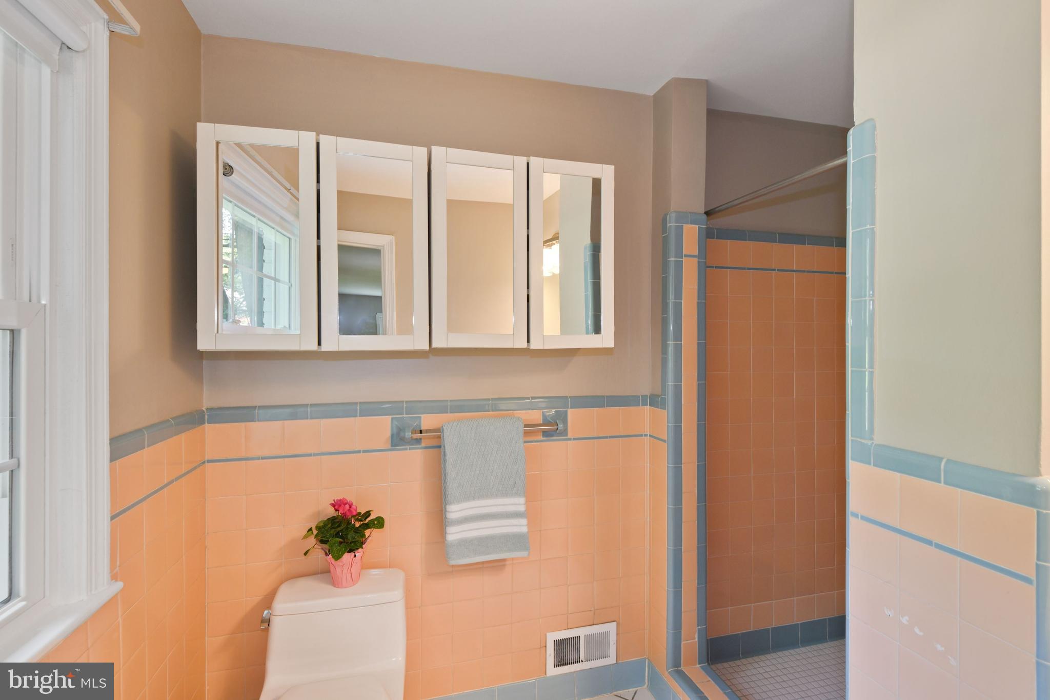 7215 Rollingwood Drive Chevy Chase, MD 20815 - Photo 29 of 42 a bathroom with a tub and shower