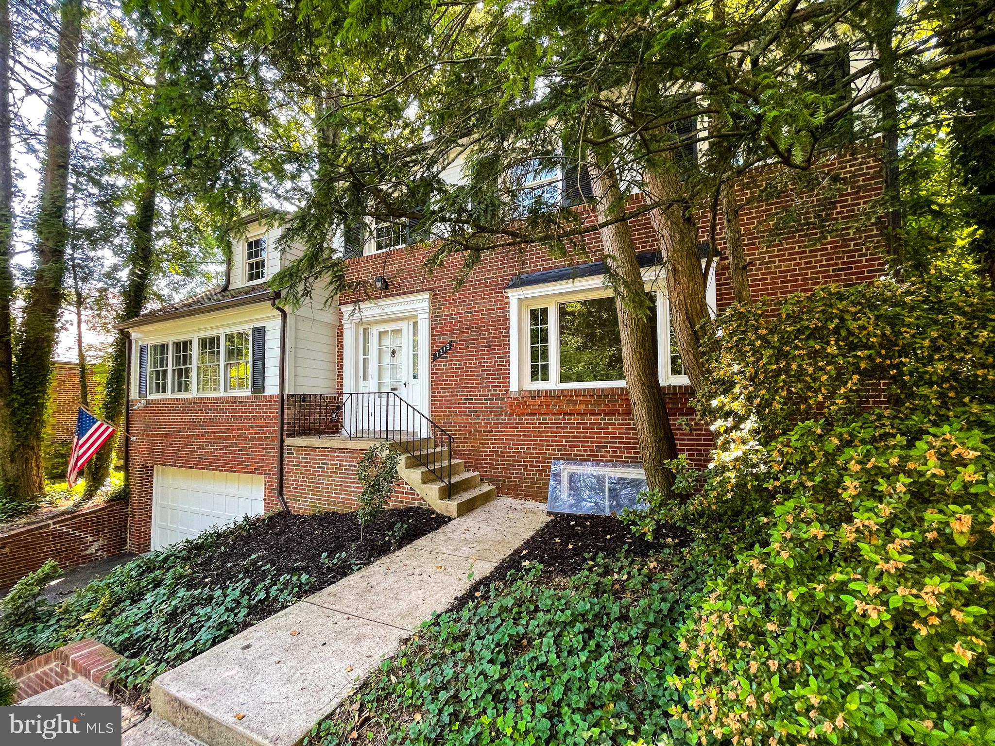 7215 Rollingwood Drive Chevy Chase, MD 20815 - Photo 4 of 42 front view of a house with a tree