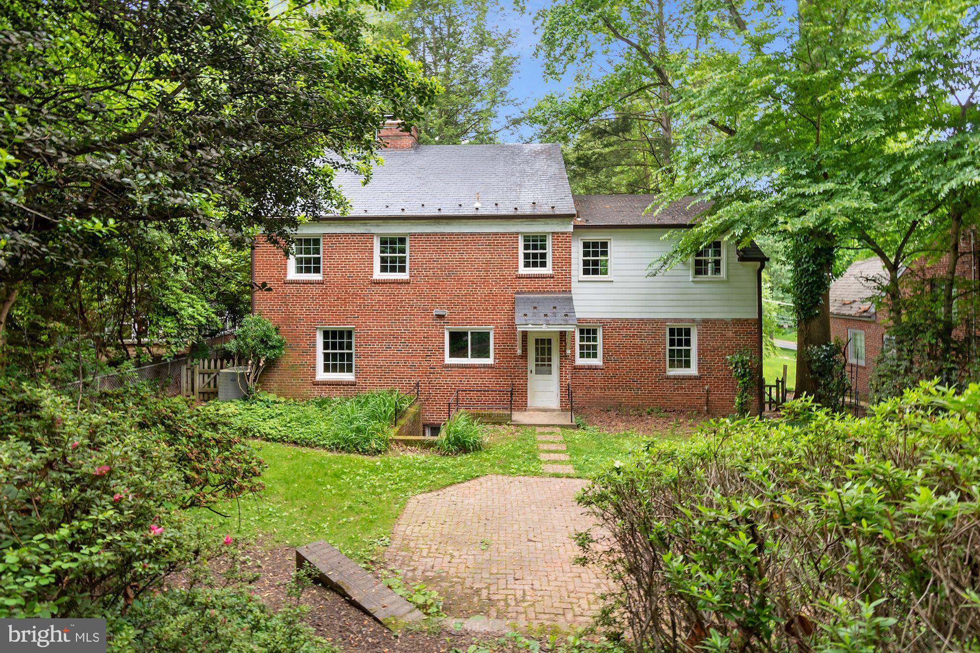 7215 Rollingwood Drive Chevy Chase, MD 20815 - Photo 39 of 42 a aerial view of a house next to a big yard and large trees