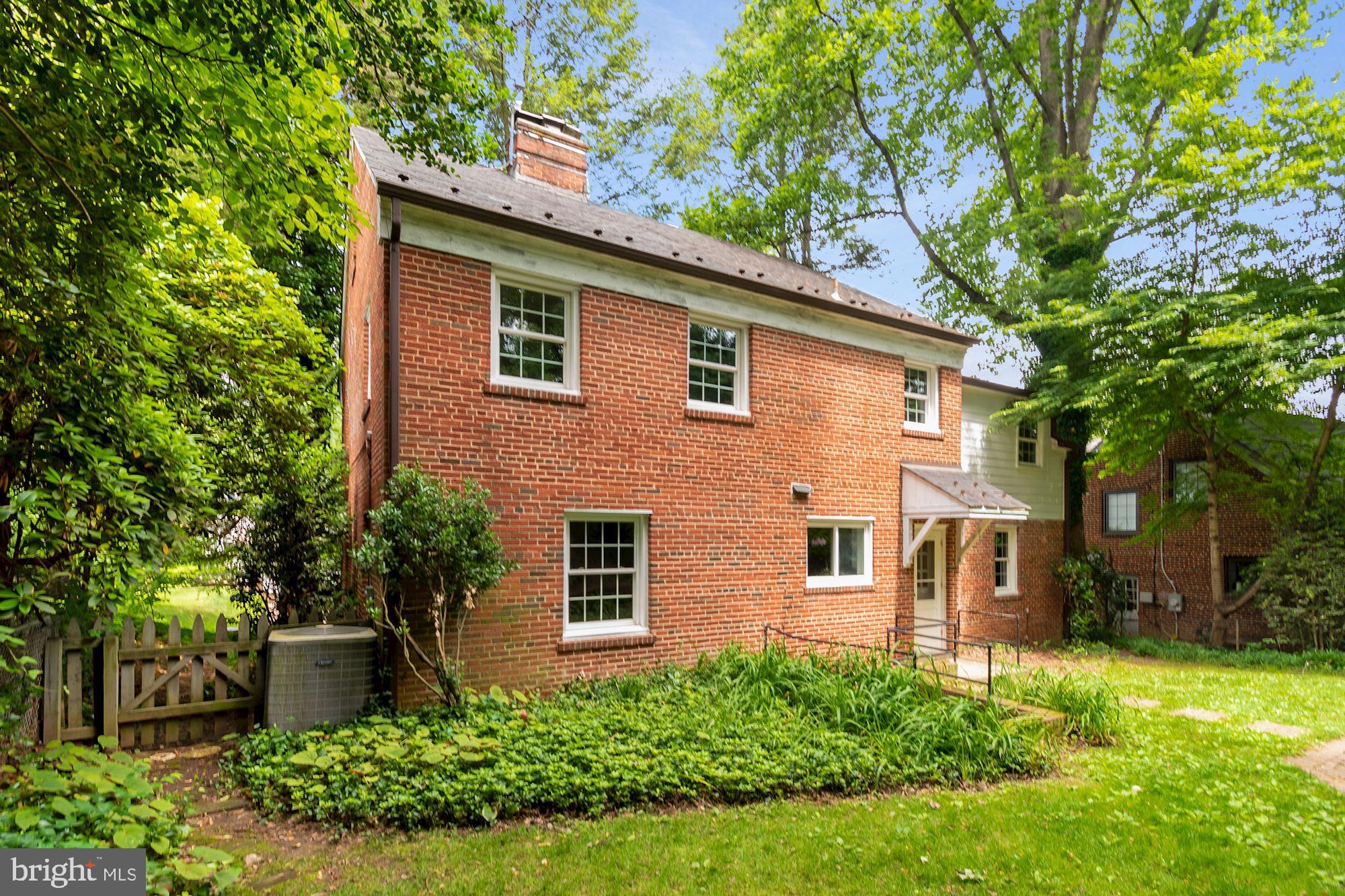 7215 Rollingwood Drive Chevy Chase, MD 20815 - Photo 40 of 42 a front view of a house with a yard