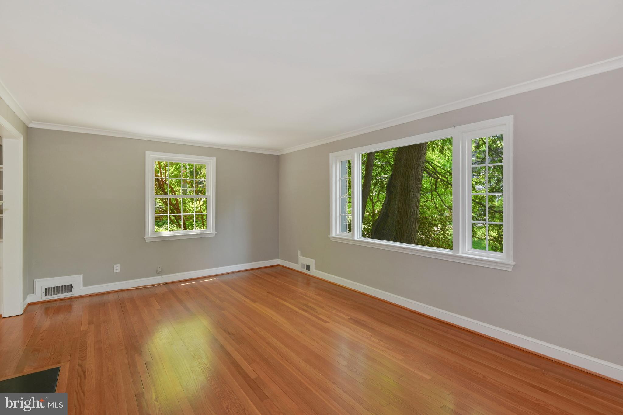 7215 Rollingwood Drive Chevy Chase, MD 20815 - Photo 7 of 42 a view of an empty room with a window