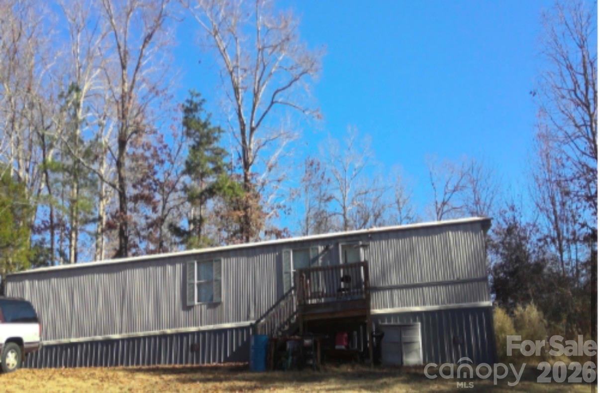 1357 Airport Rhodhiss Road, Unit 26 Hickory, NC 28601 - Photo 5 of 5 a view of wooden fence and trees