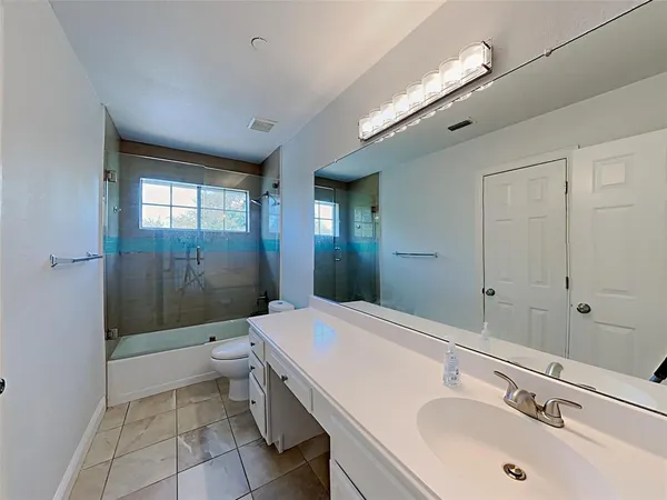 a bathroom with a sink and mirror