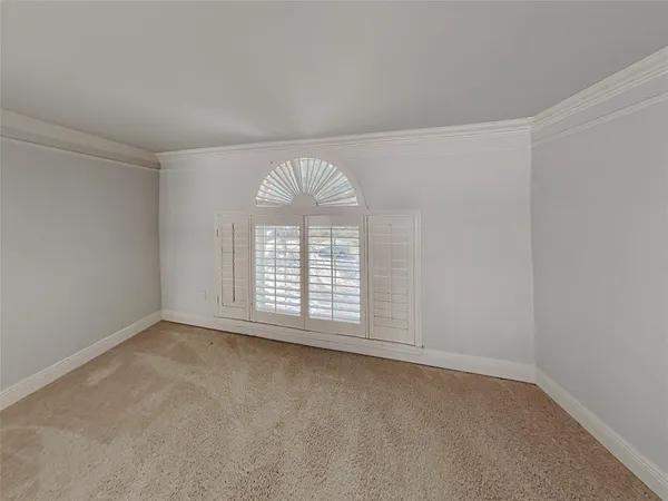 an empty room with a empty space and windows