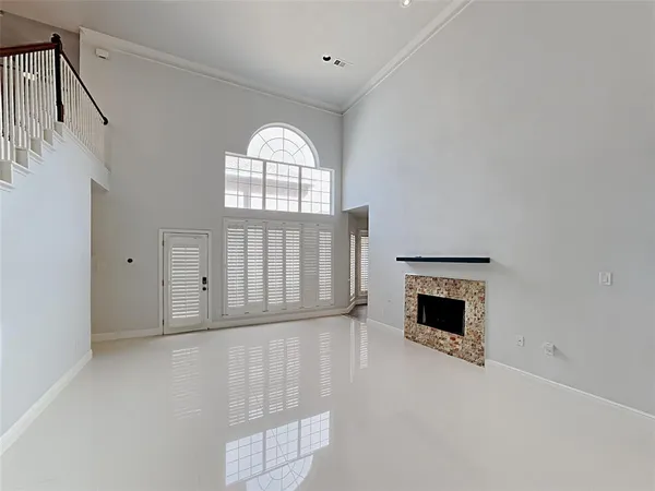 a view of empty room with a fireplace