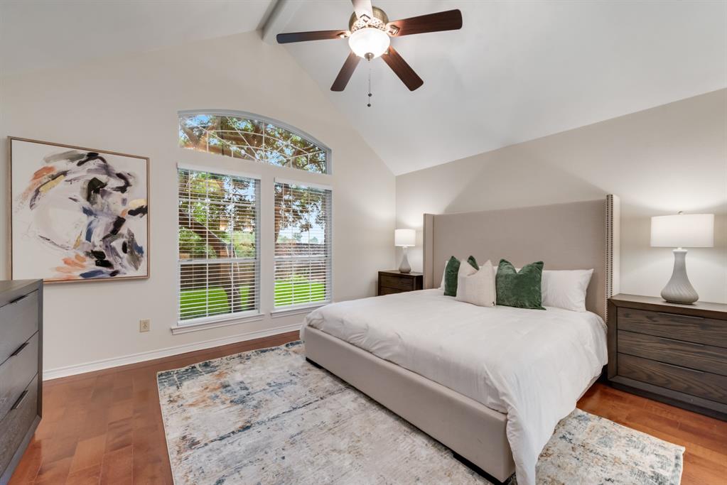 907 Sunpoint Circle Rockwall, TX 75087 - Photo 18 of 37 a bedroom with a large bed and a window