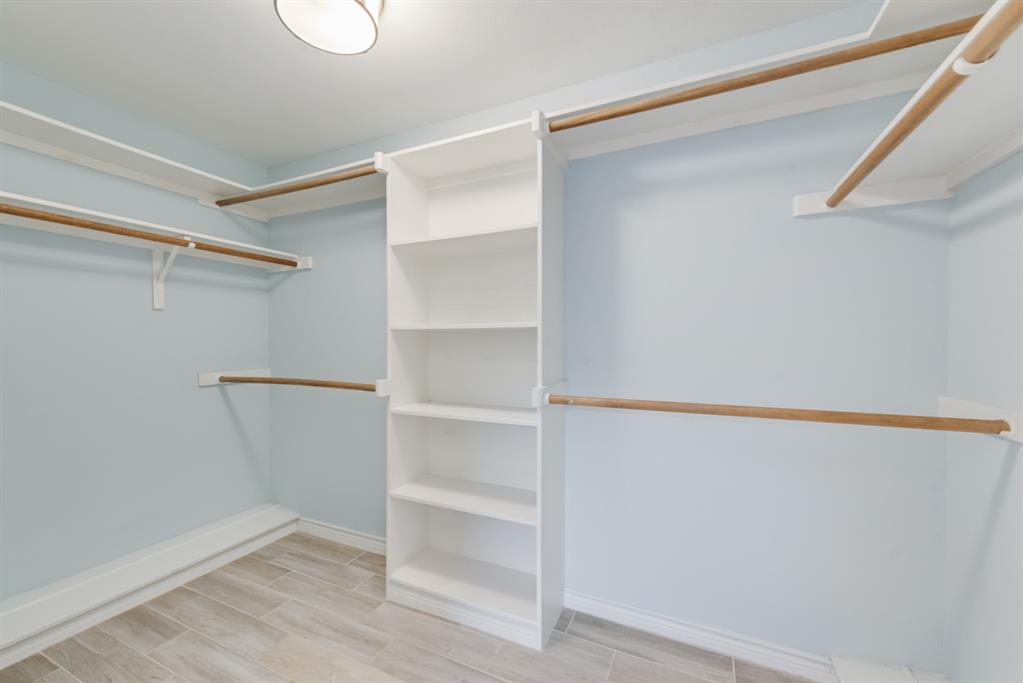 907 Sunpoint Circle Rockwall, TX 75087 - Photo 23 of 37 a view of an empty walk in closet