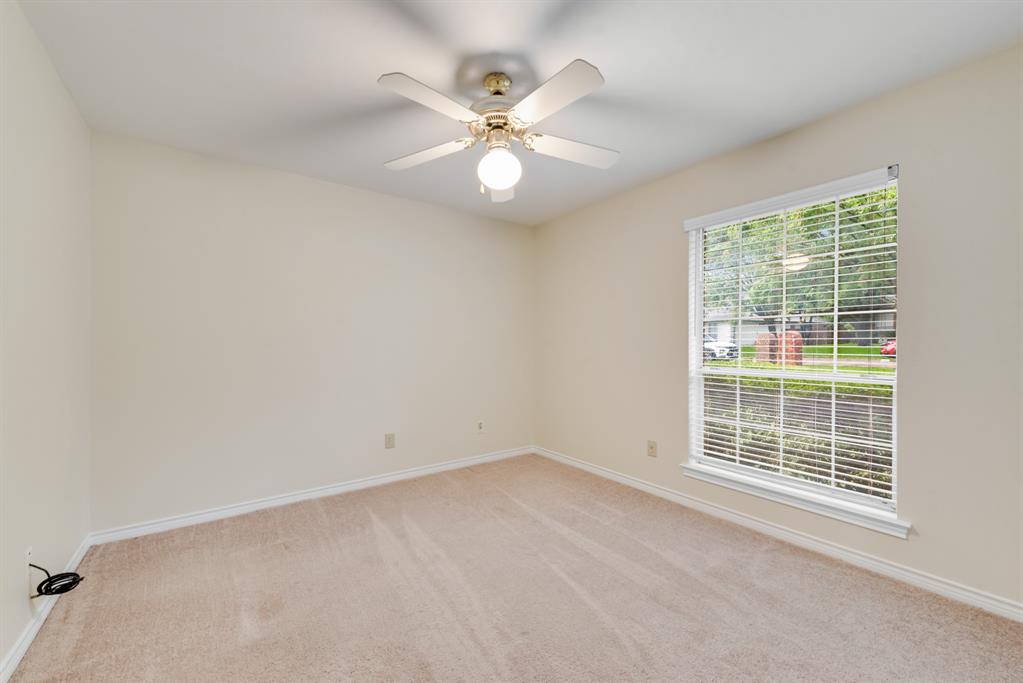 907 Sunpoint Circle Rockwall, TX 75087 - Photo 30 of 37 an empty room with windows and fan