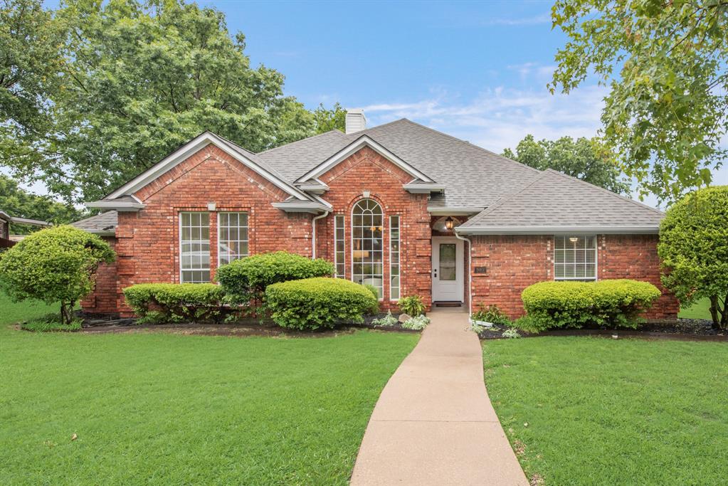 907 Sunpoint Circle Rockwall, TX 75087 - Photo 37 of 37 a front view of a house with a yard and garage
