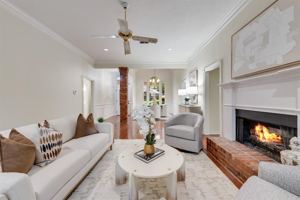 907 Sunpoint Circle Rockwall, TX 75087 - Photo 10 of 37 a living room with furniture and a fireplace