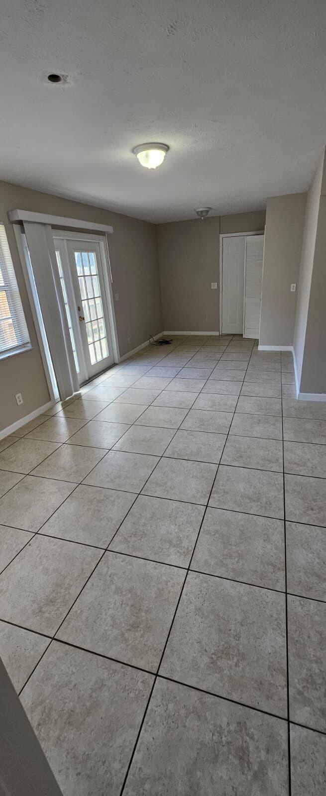 1202 Summer Street, Unit 1202 Palm Springs, FL 33461 - Photo 13 of 32 a view of an empty room and window