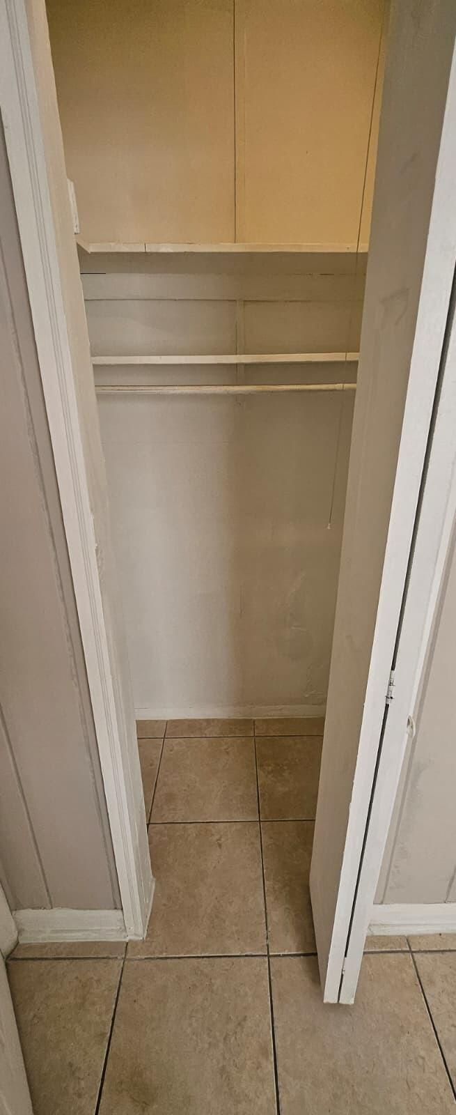 1202 Summer Street, Unit 1202 Palm Springs, FL 33461 - Photo 21 of 32 a view of walk in closet with empty racks