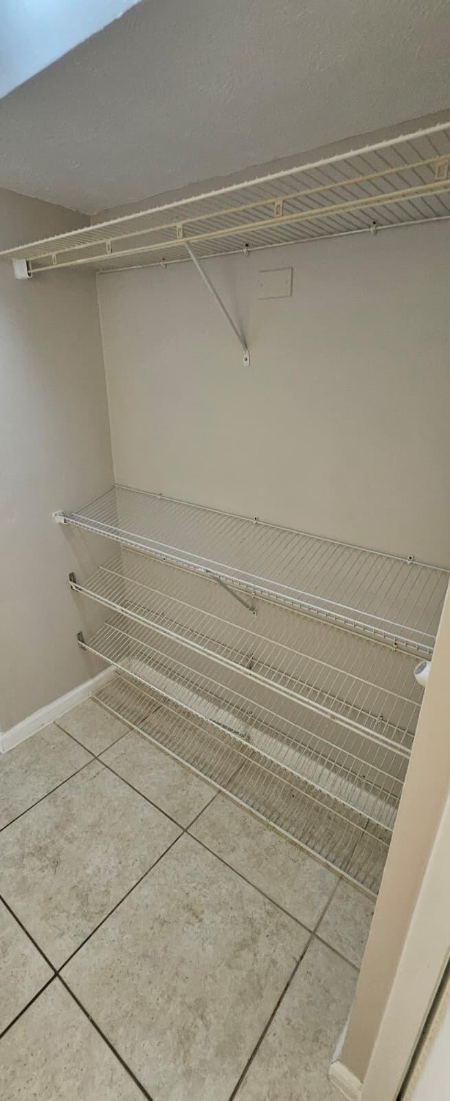 1202 Summer Street, Unit 1202 Palm Springs, FL 33461 - Photo 5 of 32 a view of a room with racks on the wall