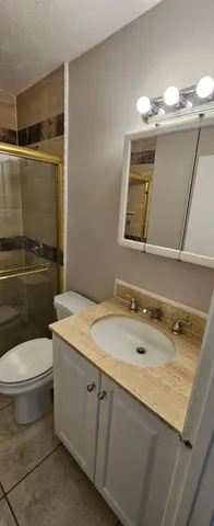 a view of bathroom with a washer and dryer